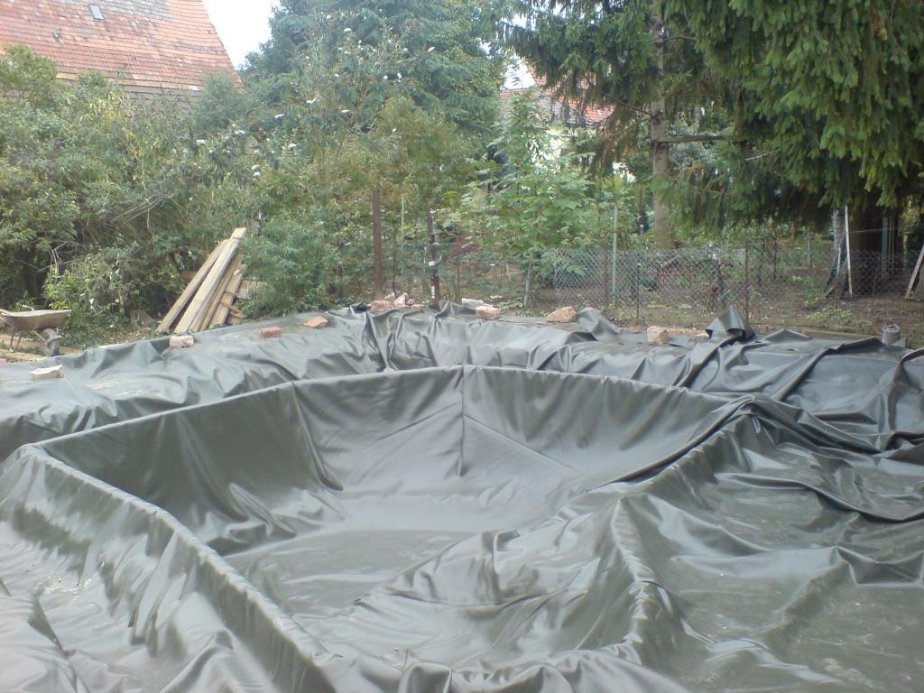 Flexible liner installed in excavated pond